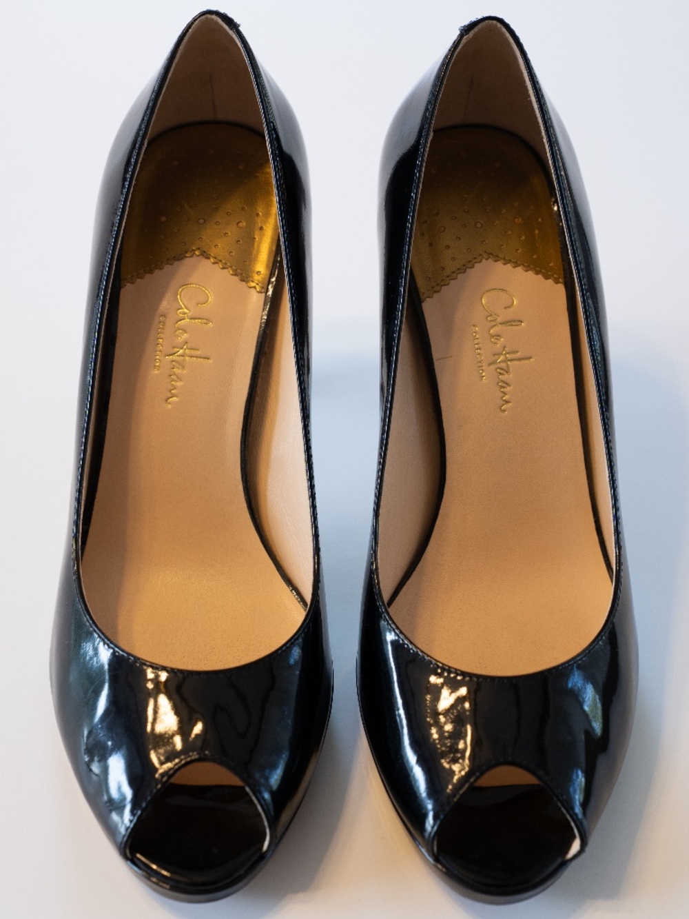 Cole Haan black patent leather peep toe pumps featuring Nike Air technology for